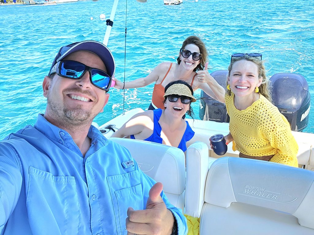 Captain Matt Wurth posing for a selfie with customers aboard the Bonnie Lee